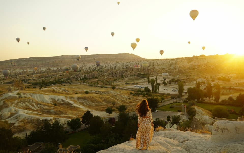 Hot air balloons over mountain range, Turkey