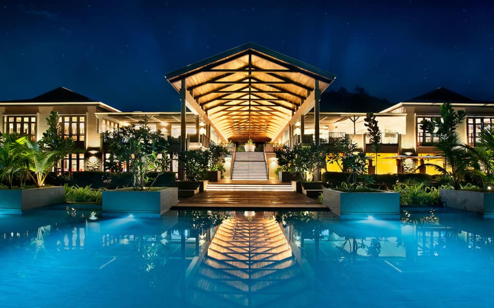 Kempinski Seychelles Beach Chairs Main Building Evening